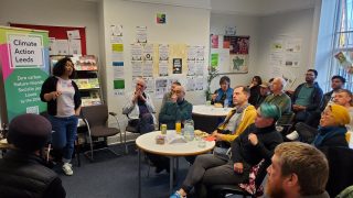 pic of group of people listening to a talk at imagine leeds