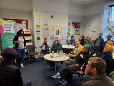 pic of group of people listening to a talk at imagine leeds